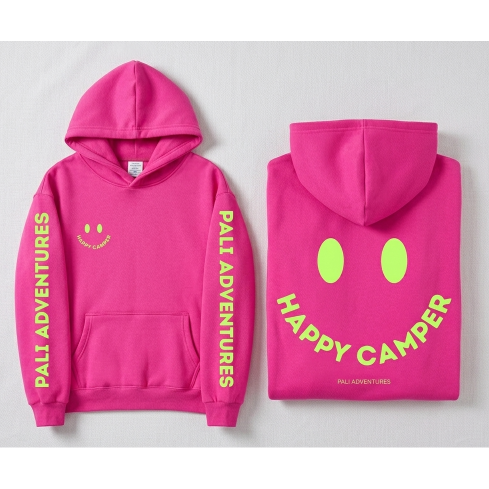 Pink hoodie with 'Pali Adventures' and 'Happy Camper' text on a light gray background